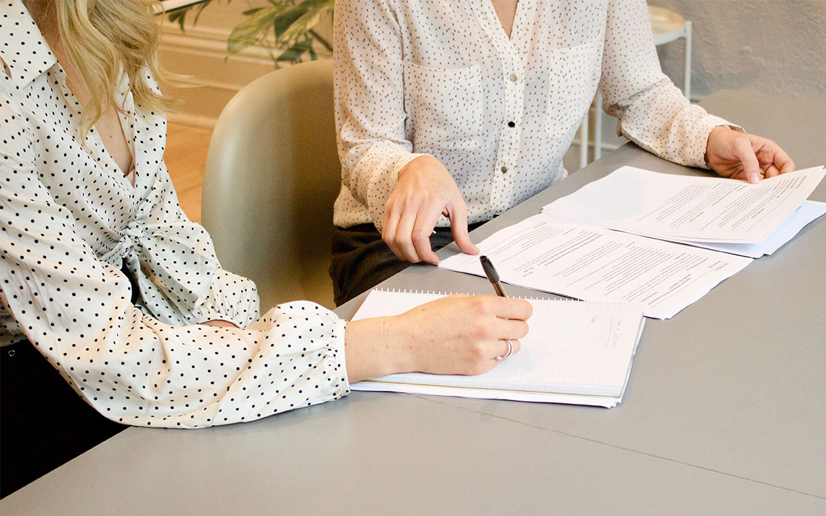 Two people meeting about important documents