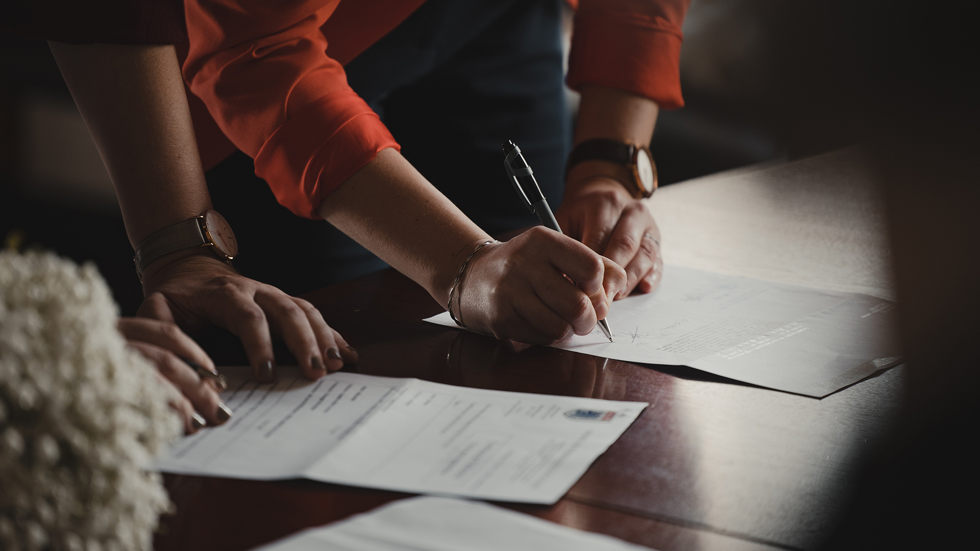 A person signing a legal document 